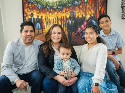 Lupe Gomez seated with her children.