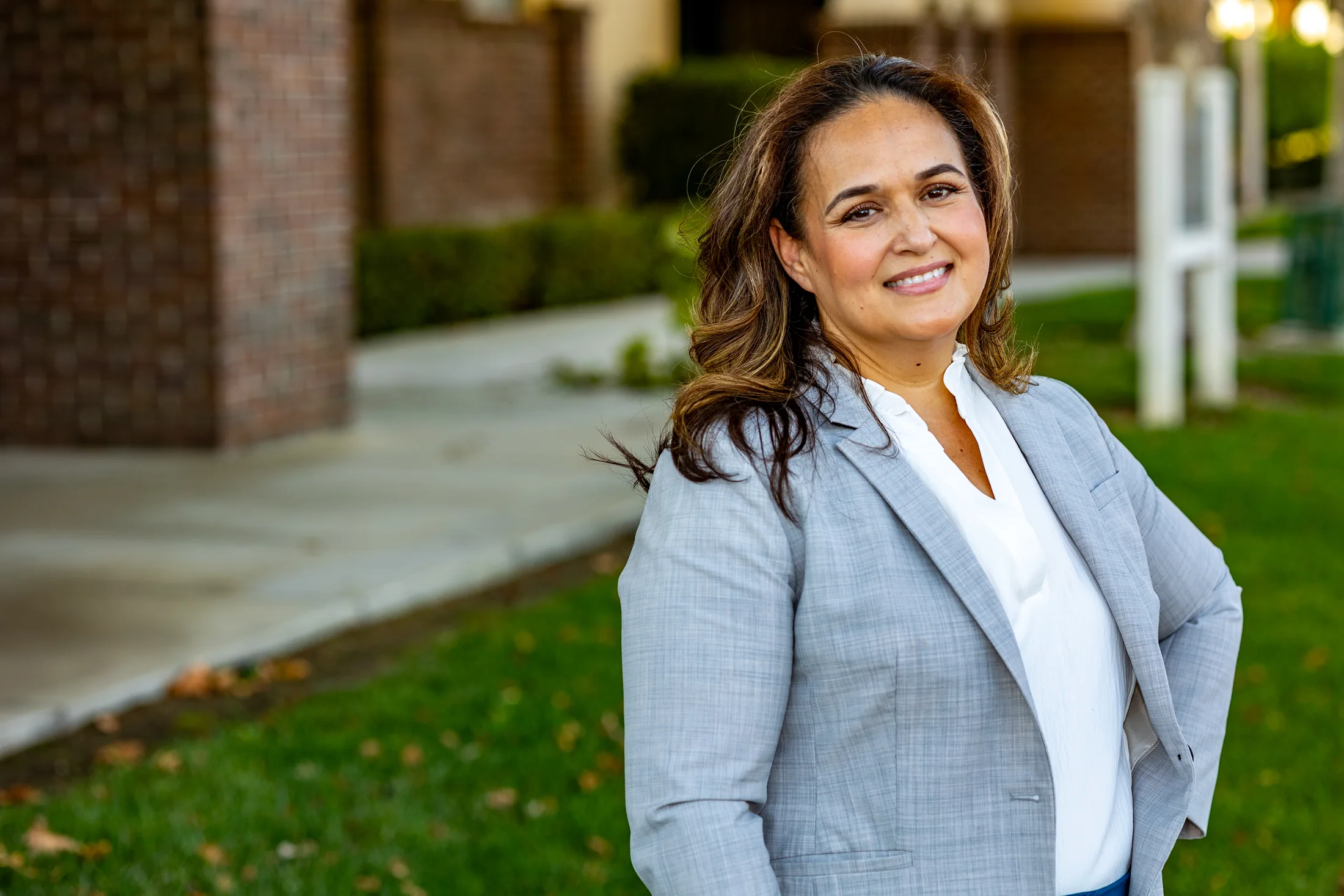 Lupe Gomez standing in a Perris neighborhood